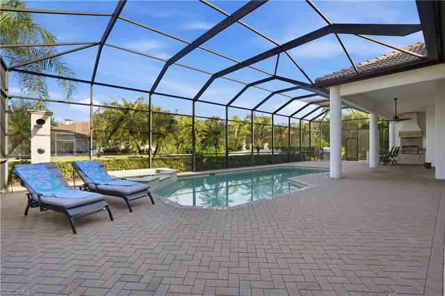 a view of a swimming pool with a patio