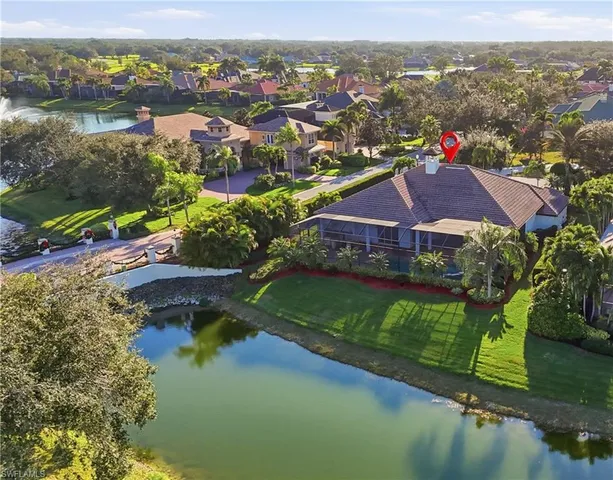 an aerial view of residential house with outdoor space and swimming pool