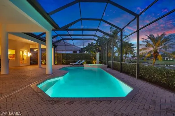 a view of a swimming pool with a patio