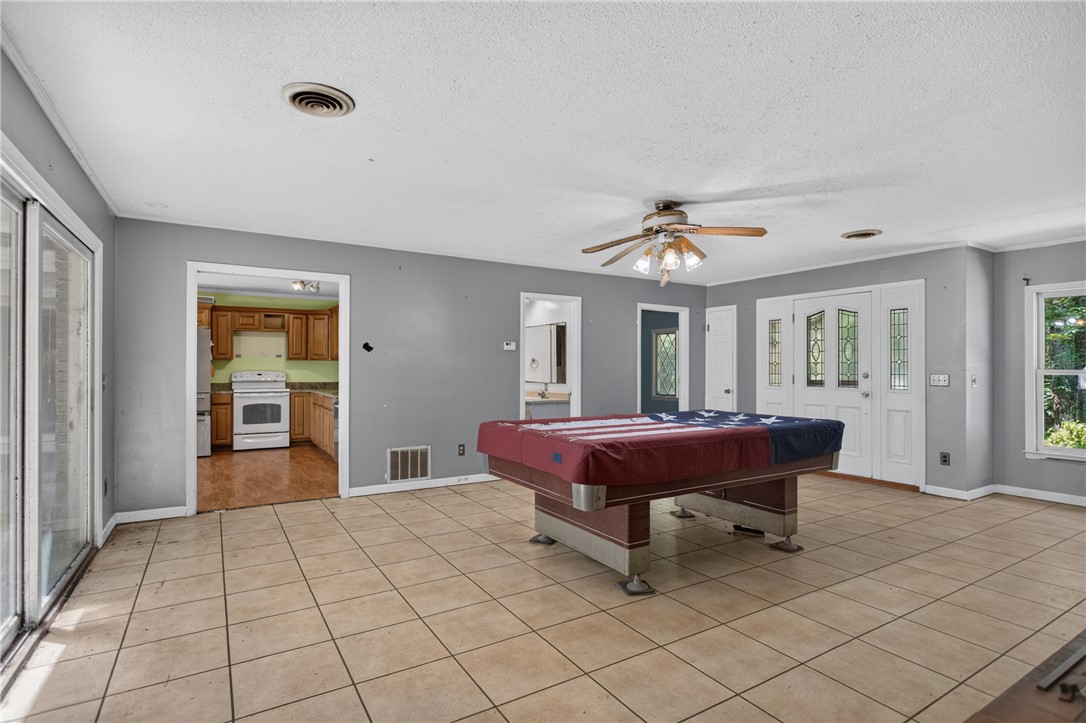 123 Robin Road Westminster, SC 29693 - Photo 13 of 50 Functional family room with tiled flooring and ample natural light.