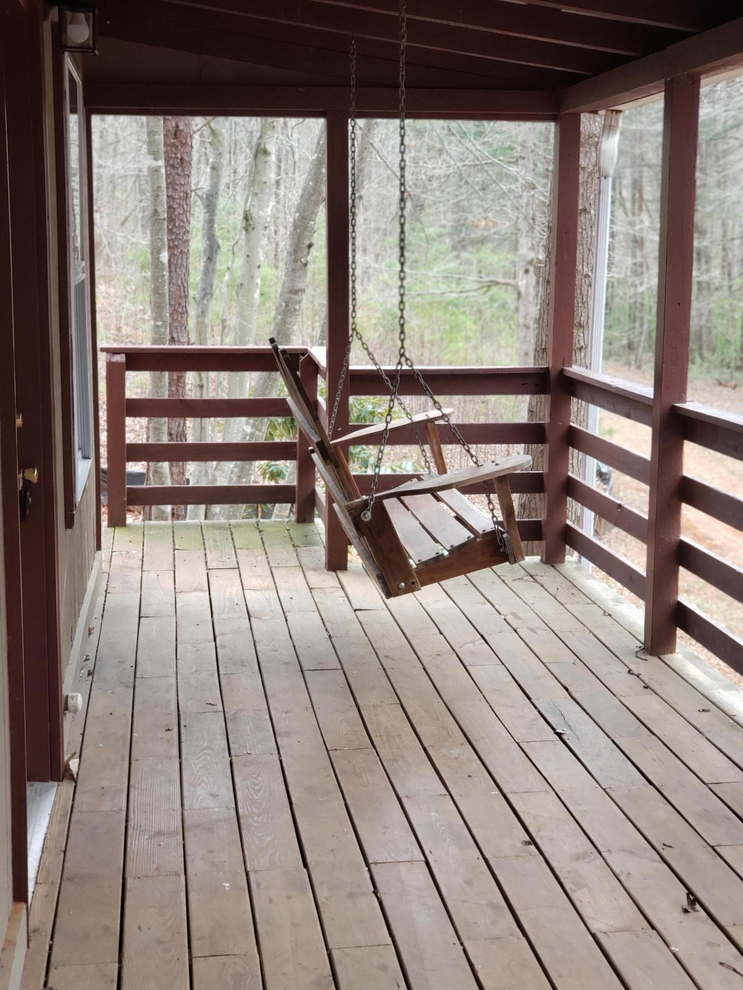 410 Peach Road Henry, VA 24102 - Photo 3 of 12 a view of a room with wooden floor and furniture