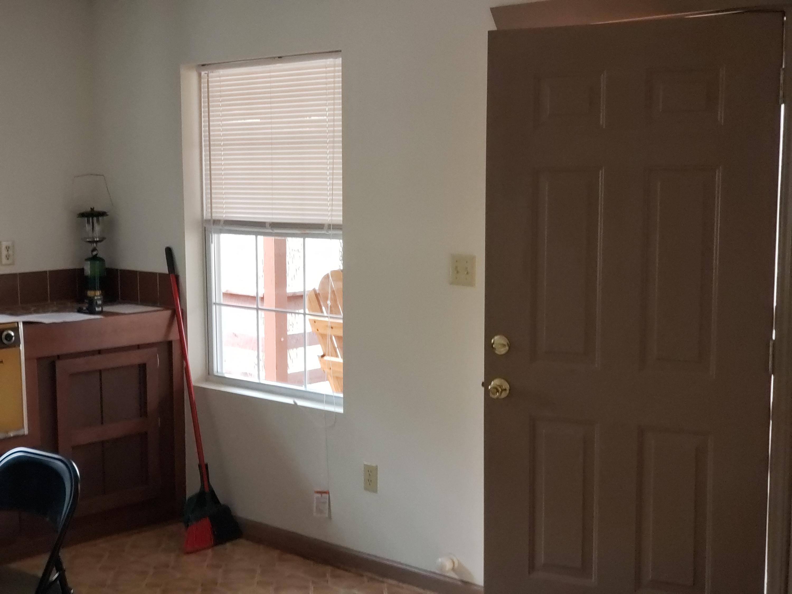 410 Peach Road Henry, VA 24102 - Photo 6 of 12 a room that has a dresser in it with a window