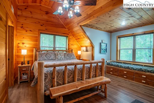 a bedroom with furniture and windows