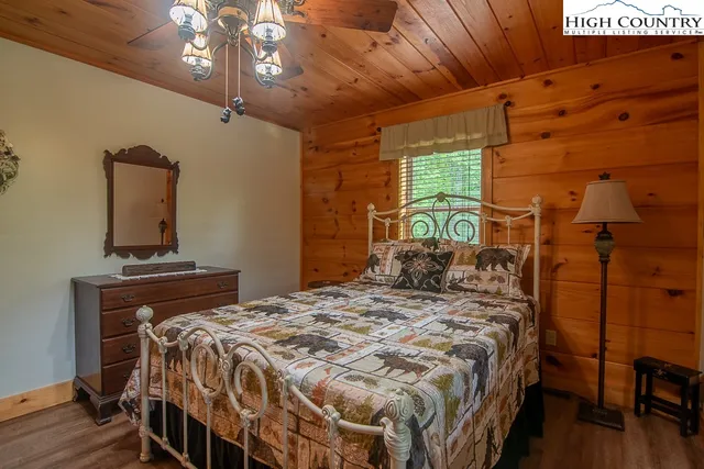 a bedroom with a bed and a table