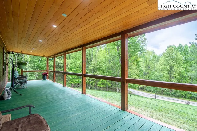 a view of outdoor space with deck and backyard