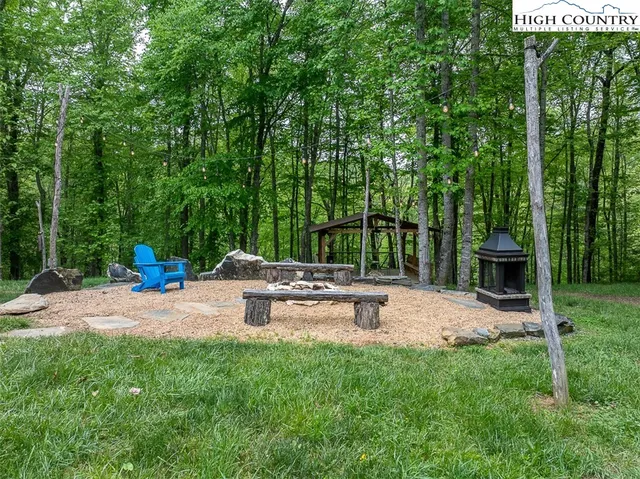 a view of a backyard with sitting area