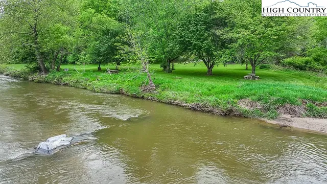 a view of a lake with a yard
