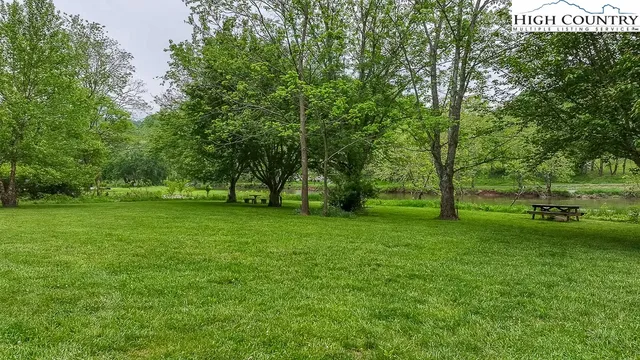 a view of outdoor space with deck and yard