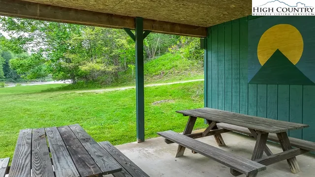 a wooden bench sitting in the middle of a park