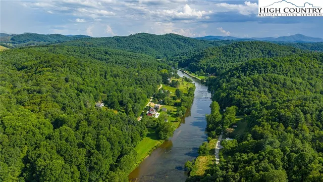 a view of a pathway both side of green field with grassy field