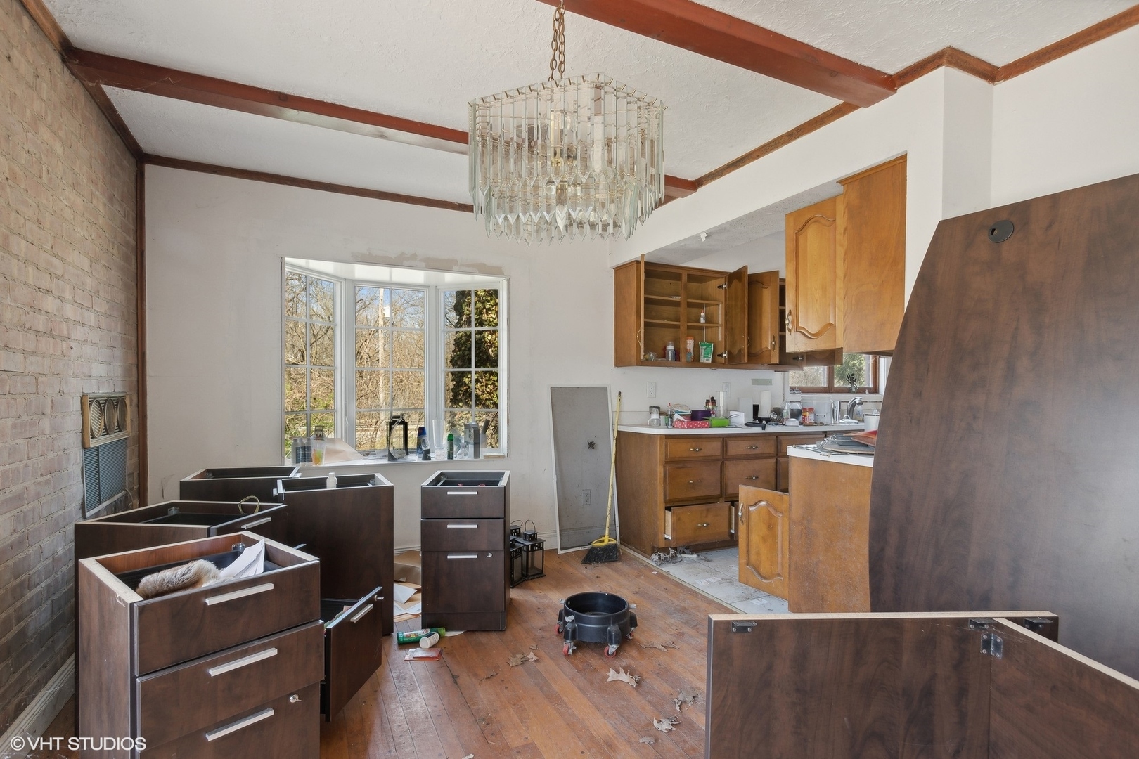 8345 McCarthy Road Palos Park, IL 60464 - Photo 8 of 18 a room with furniture a fireplace and a chandelier