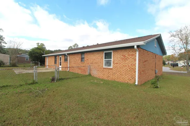 a backyard of a house with lots of green space