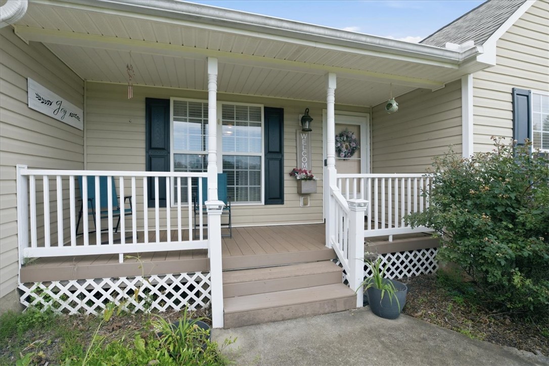520 Sharon Lane Seneca, SC 29678 - Photo 6 of 48 A welcoming front porch with white railings offers an inviting entry to this charming home.
