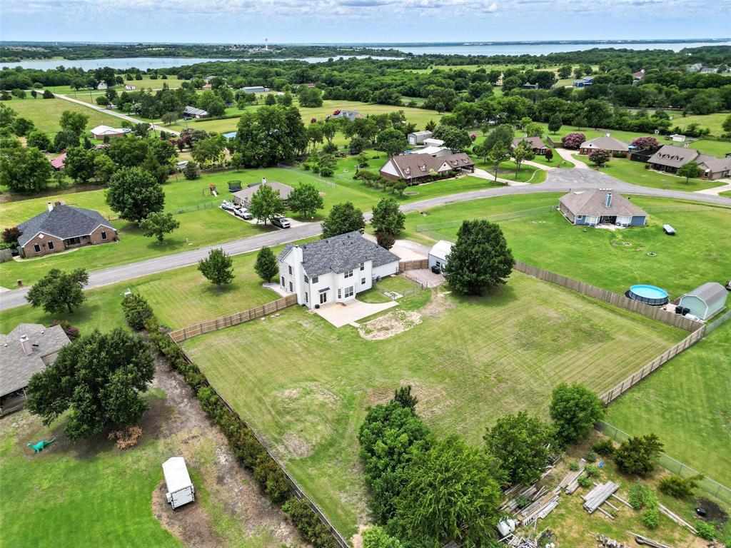 6659 Meadow Ridge Circle Nevada, TX 75173 - Photo 27 of 27 Aerial view of residential area featuring a large body of water