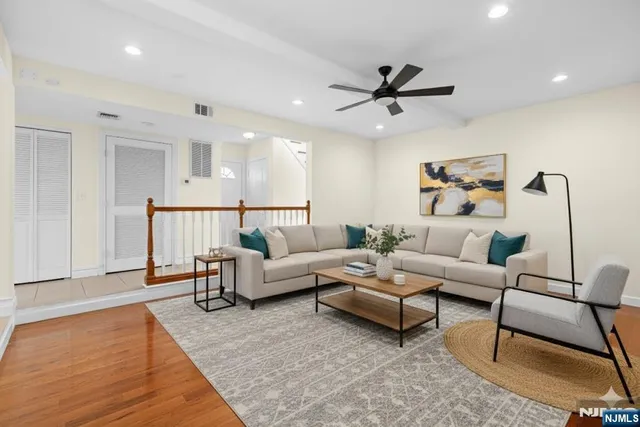 a living room with furniture and a rug