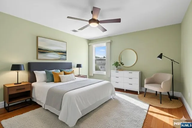 a bed room with a bed window and a chair