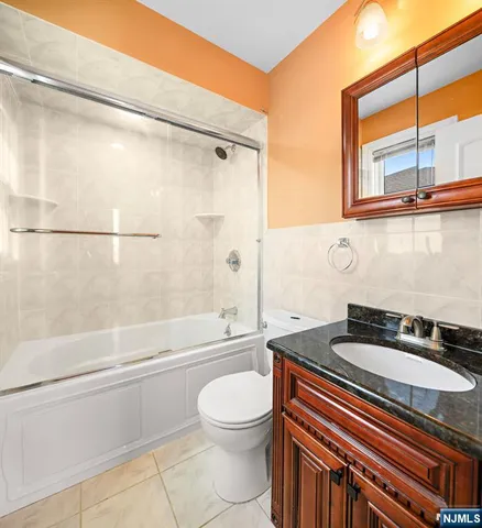 a bathroom with a sink a toilet and a bathtub