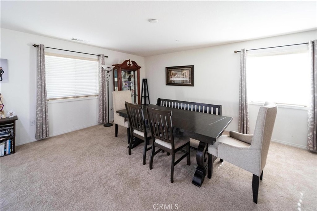 12956 Azalea Street Moreno Valley, CA 92555 - Photo 7 of 34 a view of a workspace with furniture and a window