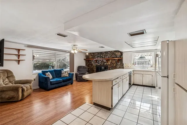 a kitchen with appliances a sink and cabinets