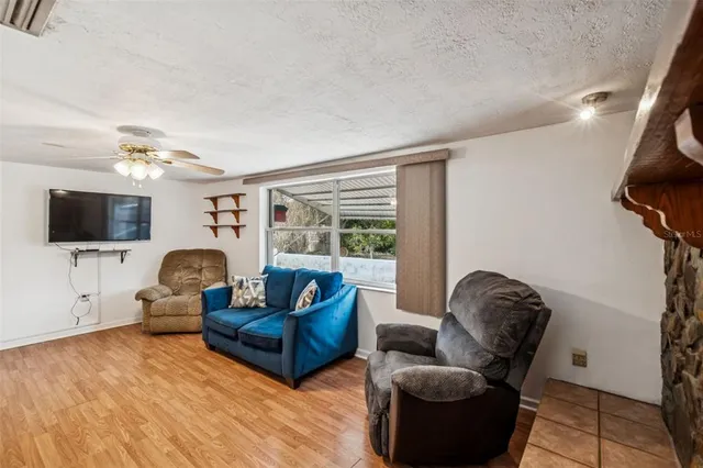 a bathroom with a sink a toilet a mirror and shower curtain