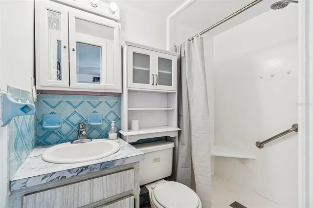 a view of a yard with a large tree