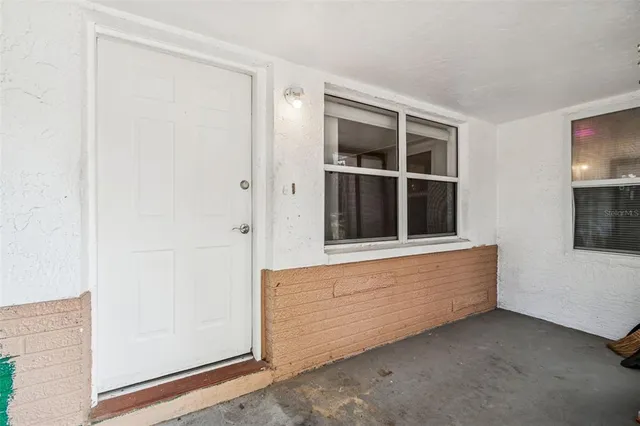 a view of an empty room and window