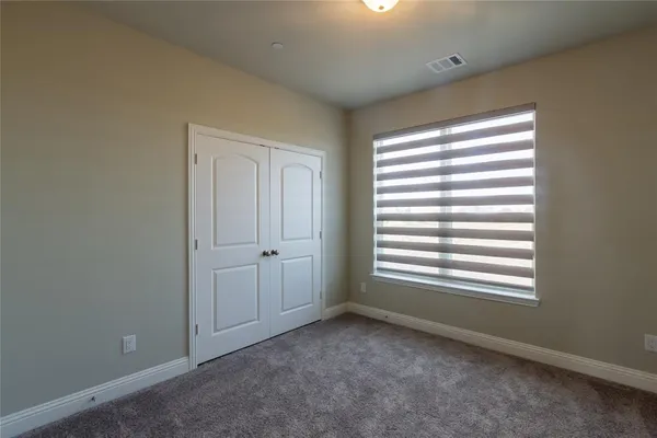 a view of a room that has a window in it
