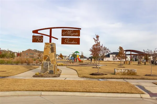a view of a house with a yard and mountain view