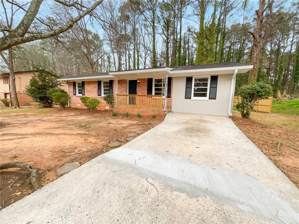 4631 Santa Fe Trail Southwest Atlanta, GA 30331 - Photo 1 of 1 a front view of a house with a garden