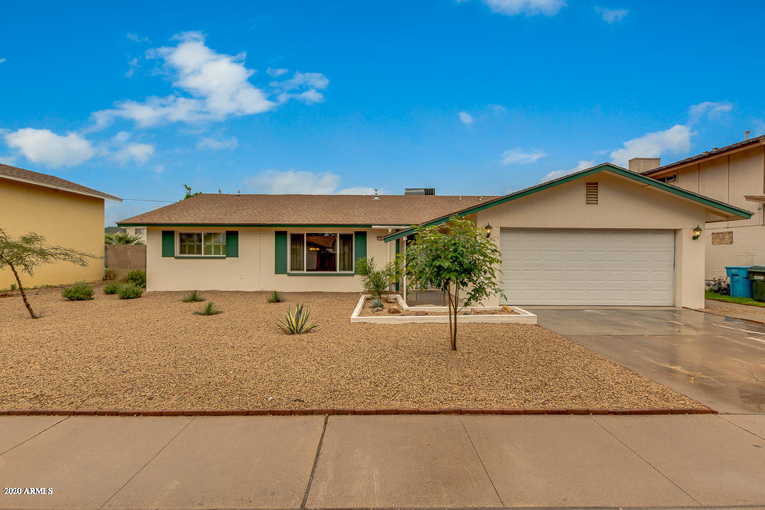 3931 West Rancho Drive Phoenix, AZ 85019 - Photo 1 of 32 a view of a house with a yard