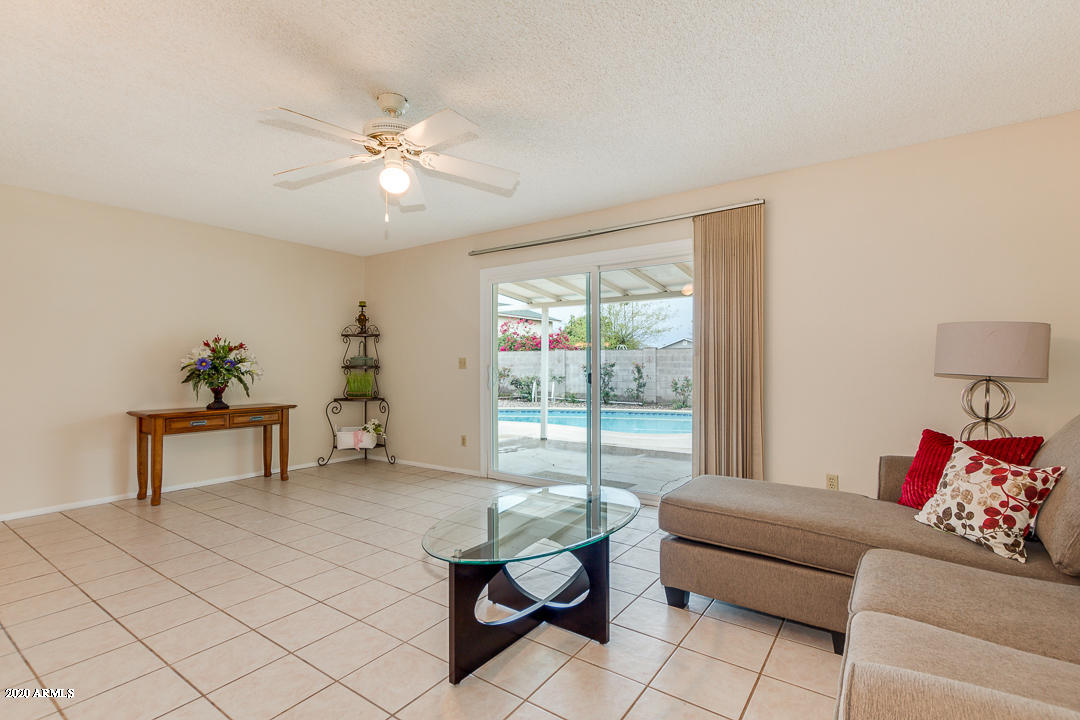 3931 West Rancho Drive Phoenix, AZ 85019 - Photo 14 of 32 a living room with furniture and a potted plant