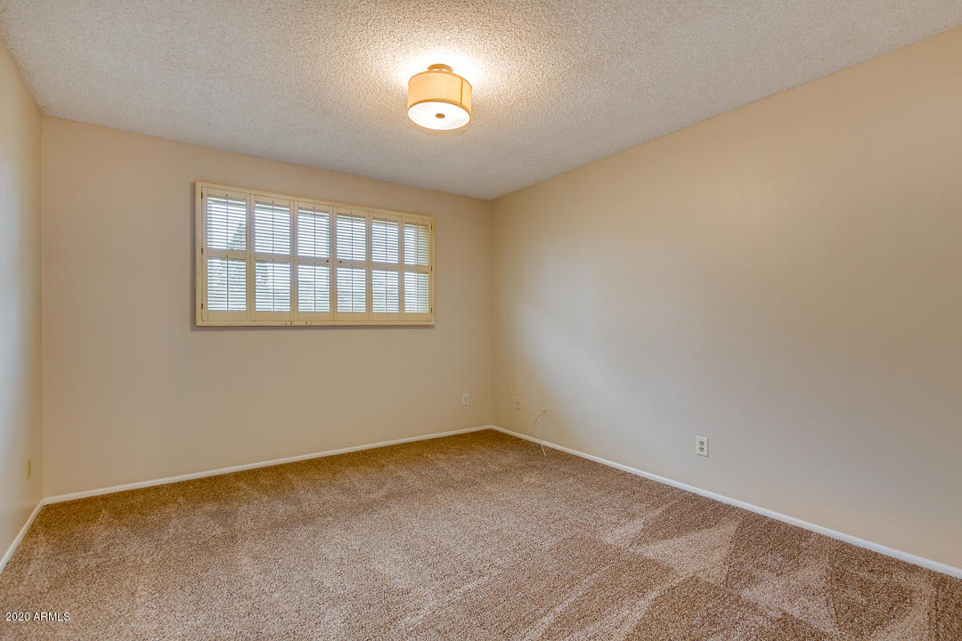 3931 West Rancho Drive Phoenix, AZ 85019 - Photo 23 of 32 an empty room with a window