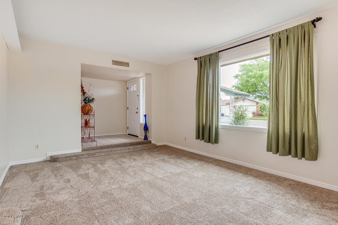 3931 West Rancho Drive Phoenix, AZ 85019 - Photo 5 of 32 an empty room with windows