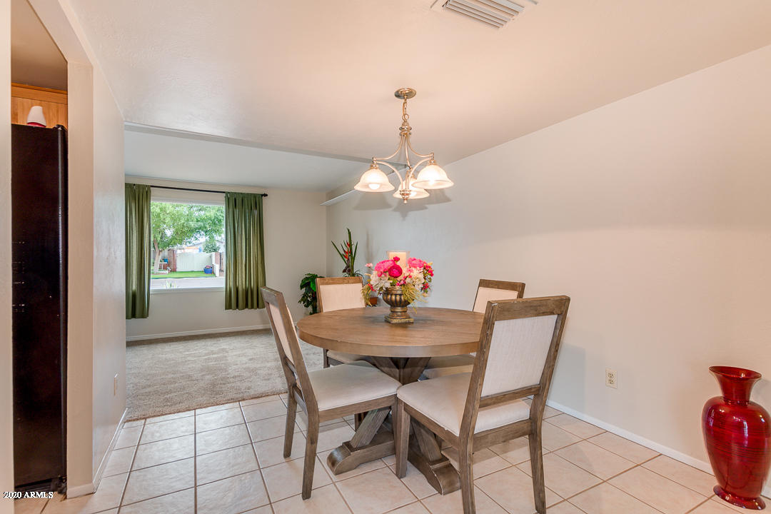 3931 West Rancho Drive Phoenix, AZ 85019 - Photo 7 of 32 a dining room with furniture and window