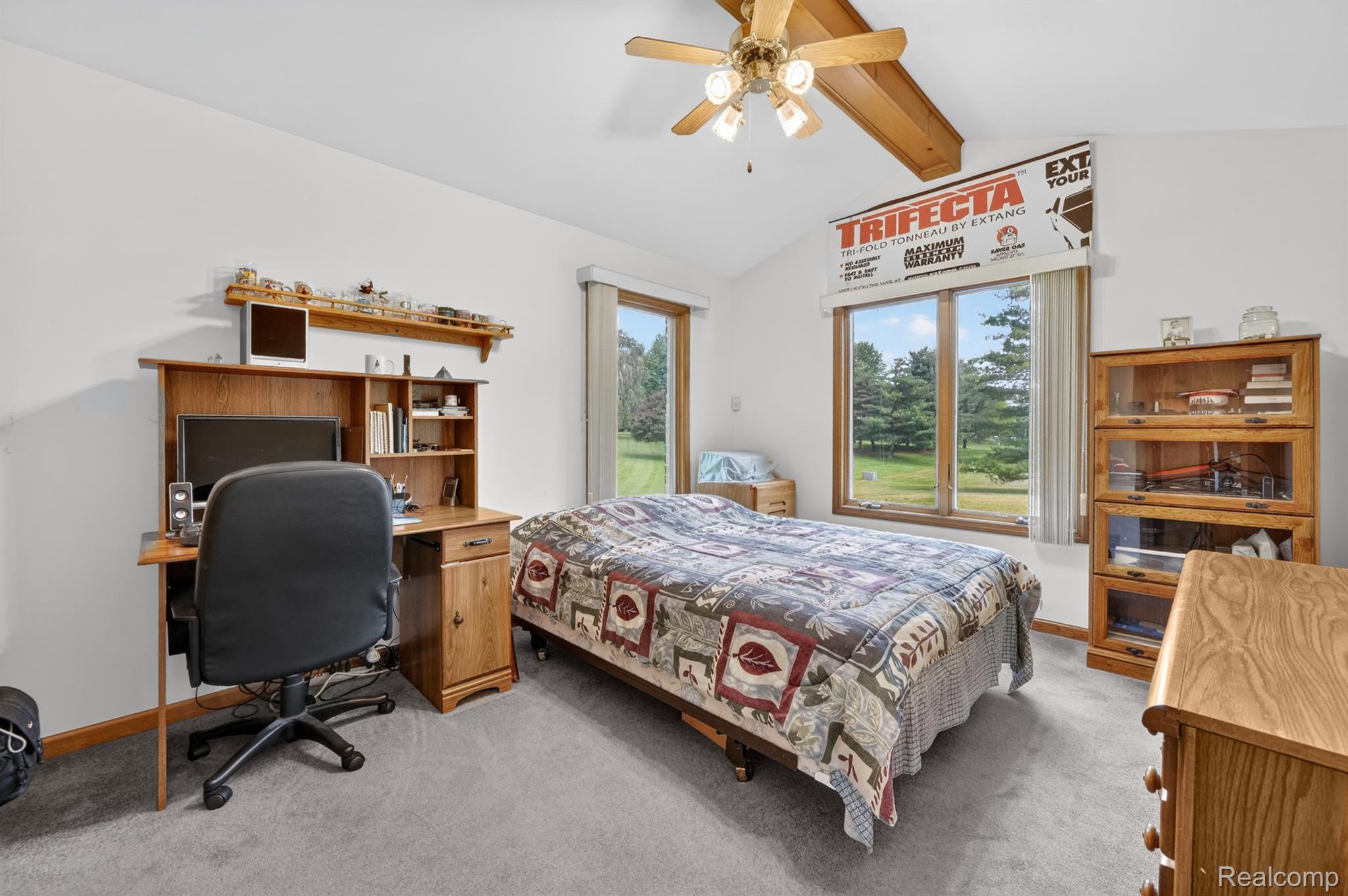 8558 37 Mile Road Romeo, MI 48065 - Photo 14 of 29 Vaulted ceilings featuring exposed wood beams and a ceiling fan
