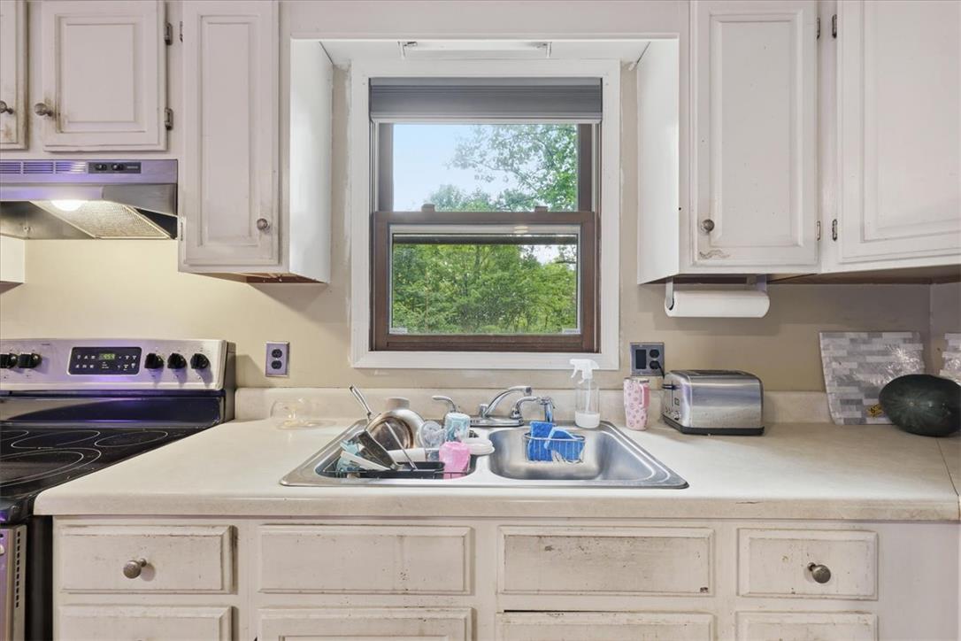 520 Highland Hill Road Jim Thorpe, PA 18235 - Photo 18 of 83 A well-lit kitchen with ample counter space and a pleasant window view.