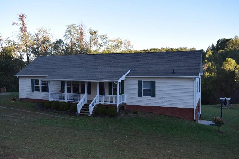 440 Horse Ridge Road Northwest Willis, VA 24380 - Photo 11 of 62 front view of a house with a yard