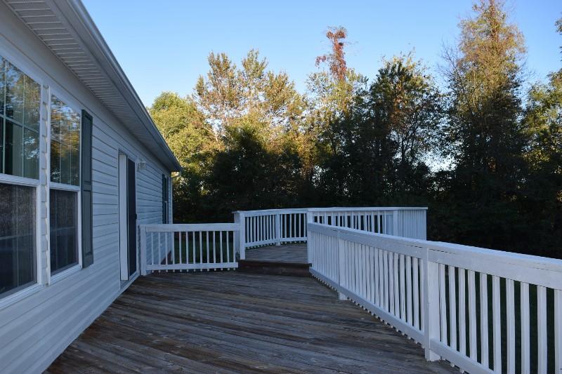 440 Horse Ridge Road Northwest Willis, VA 24380 - Photo 5 of 62 a view of balcony with wooden floor and fence and trees