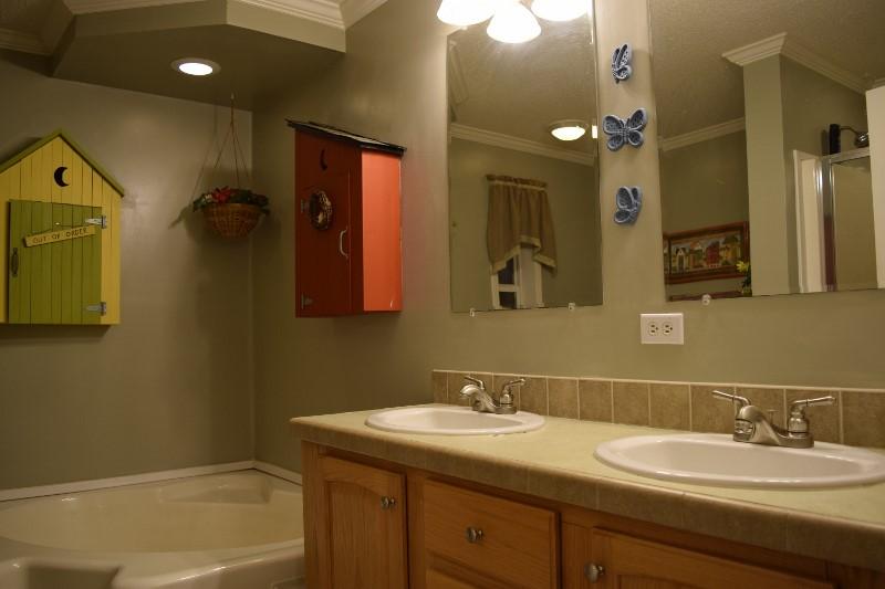 440 Horse Ridge Road Northwest Willis, VA 24380 - Photo 51 of 62 a bathroom with a granite countertop sink and a mirror