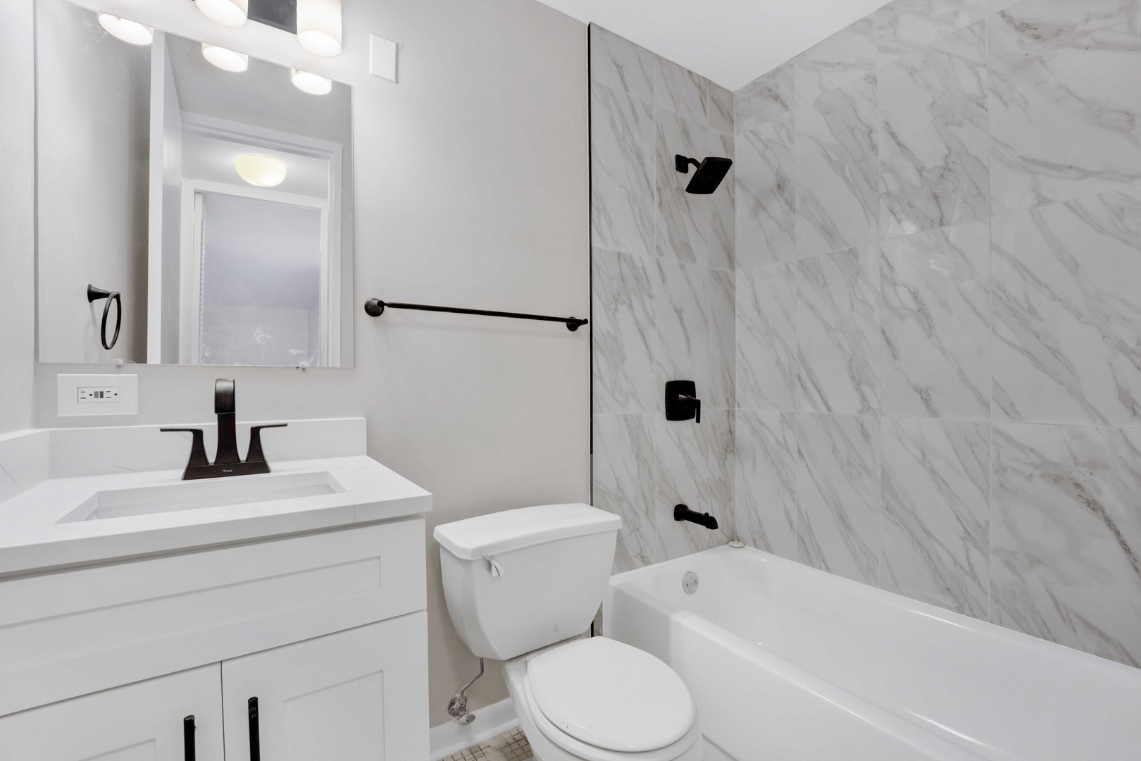 720 West Gordon Terrace, Unit 7F Chicago, IL 60613 - Photo 12 of 15 a bathroom with a sink toilet and shower