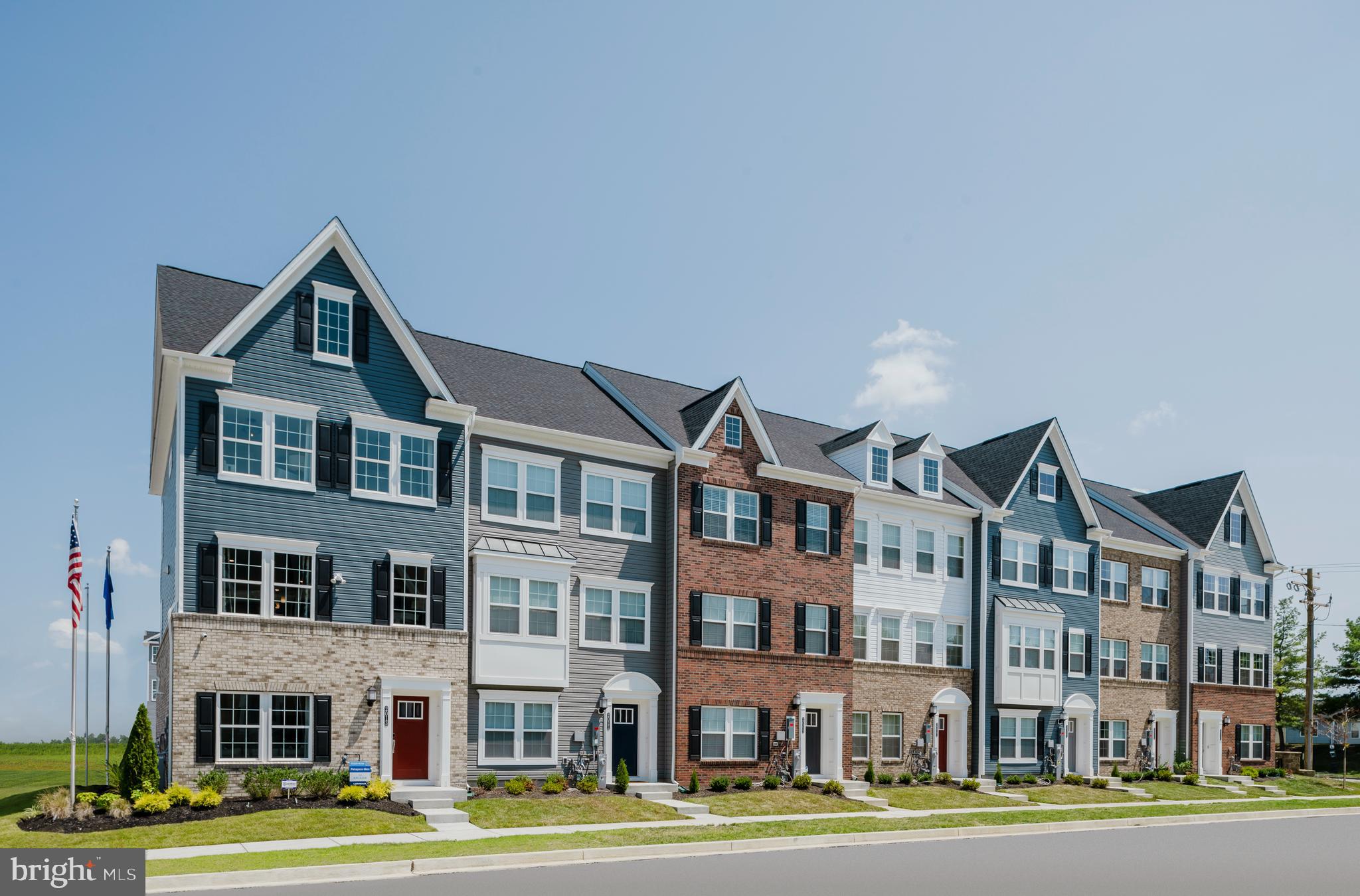 1806 Oxbow Road Baltimore, MD 21244 - Photo 1 of 10 a front view of a building with lot of trees and plants