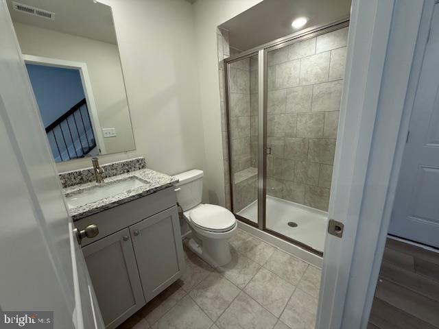 1806 Oxbow Road Baltimore, MD 21244 - Photo 11 of 14 a bathroom with a granite countertop sink toilet and shower