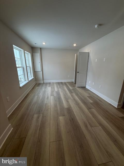 1806 Oxbow Road Baltimore, MD 21244 - Photo 2 of 14 an empty room with wooden floor and windows