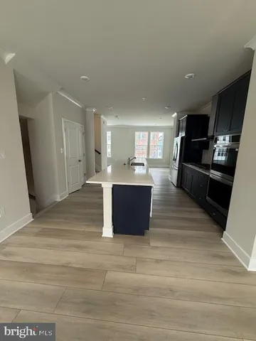 a large room with kitchen island