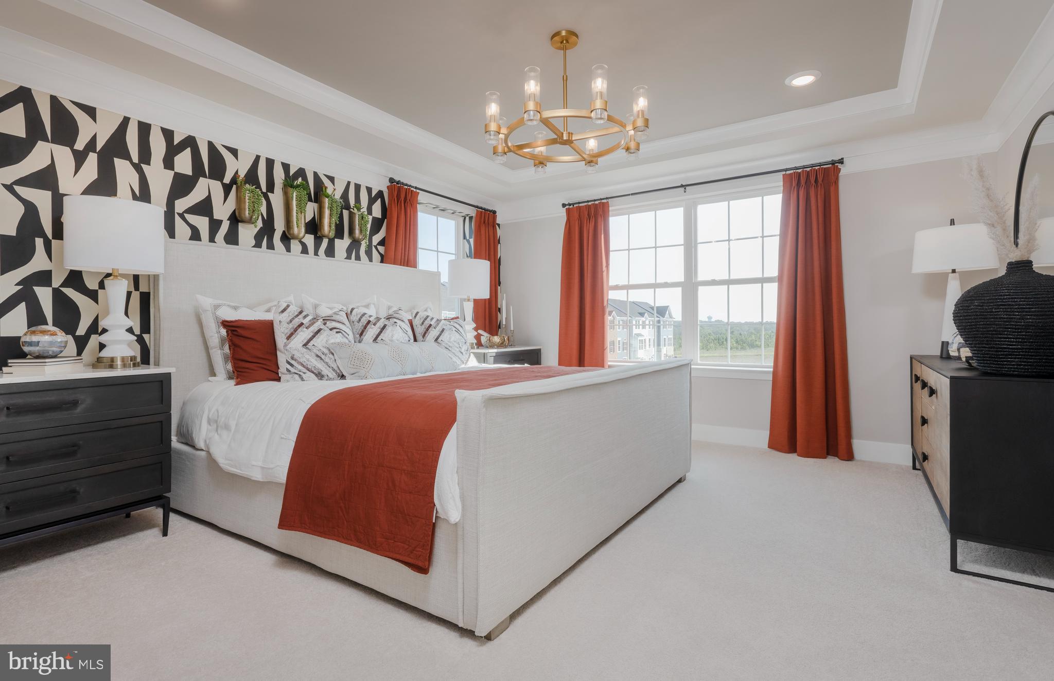 1806 Oxbow Road Baltimore, MD 21244 - Photo 5 of 10 a bedroom with a bed and a chandelier