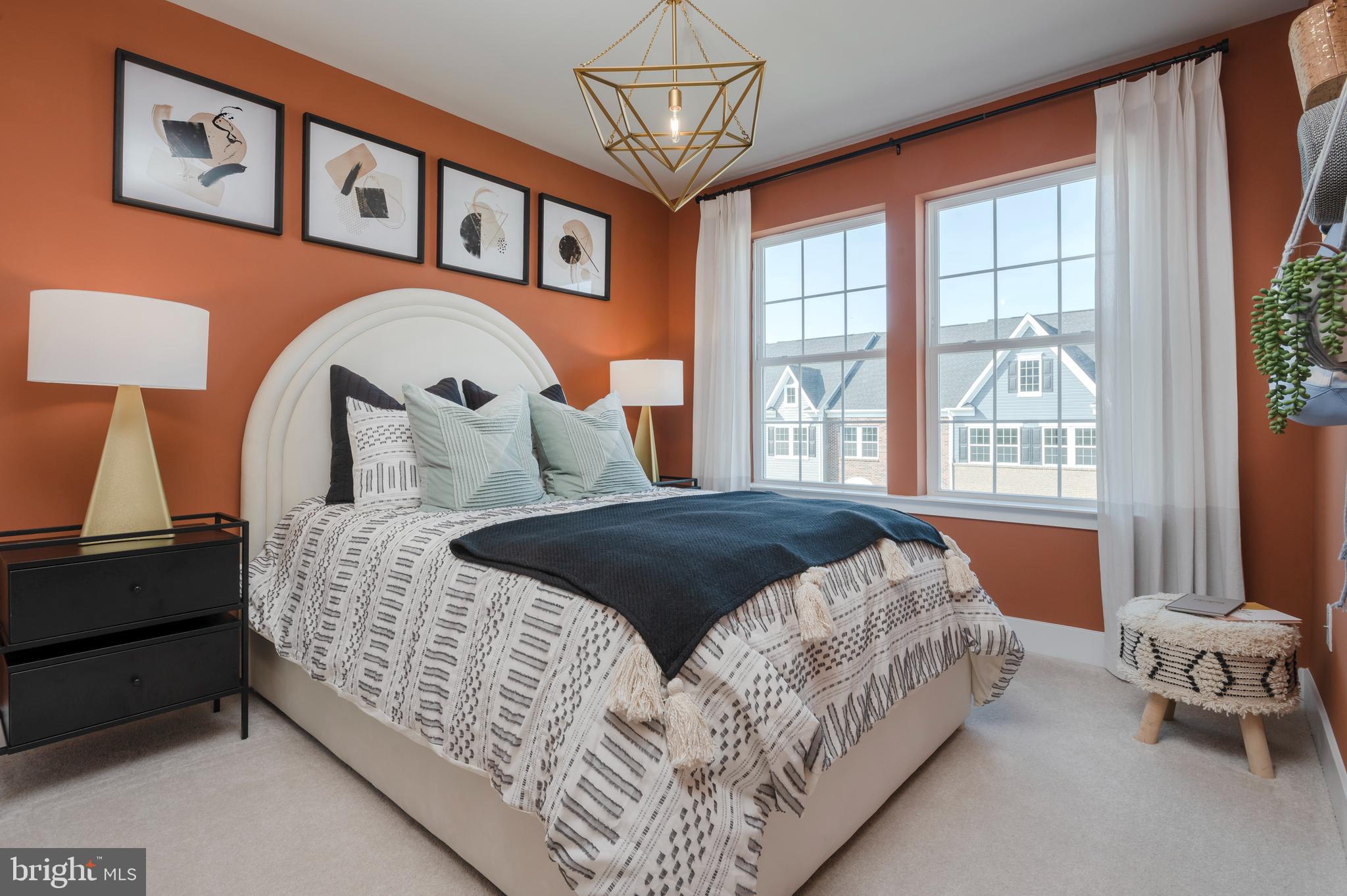 1806 Oxbow Road Baltimore, MD 21244 - Photo 9 of 10 a bedroom with a large bed and a window