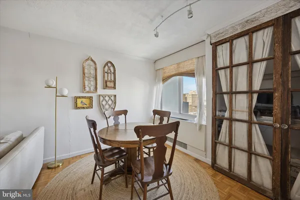 a view of a dining room with furniture window and wooden floor