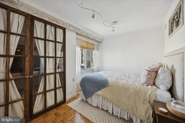 a bedroom with a bed and cabinets