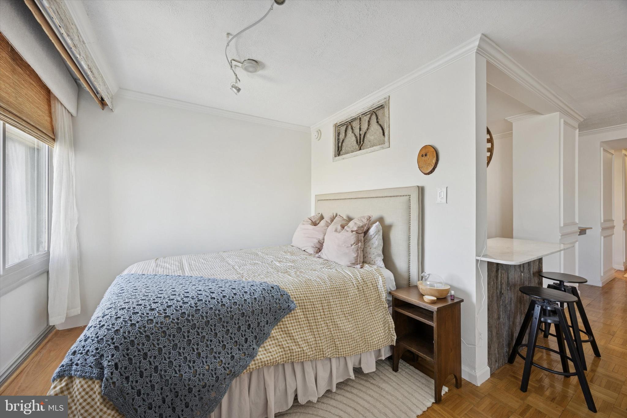 604 South Washington Square, Unit 1806 Philadelphia, PA 19106 - Photo 14 of 23 a bedroom with a bed and cabinets