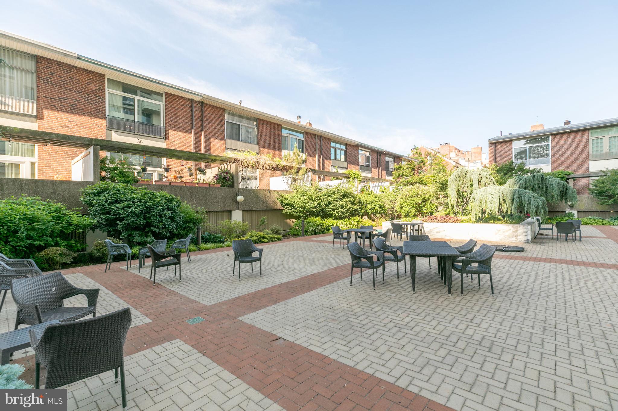 604 South Washington Square, Unit 1806 Philadelphia, PA 19106 - Photo 22 of 23 a view of a patio with couches table and chairs and potted plants